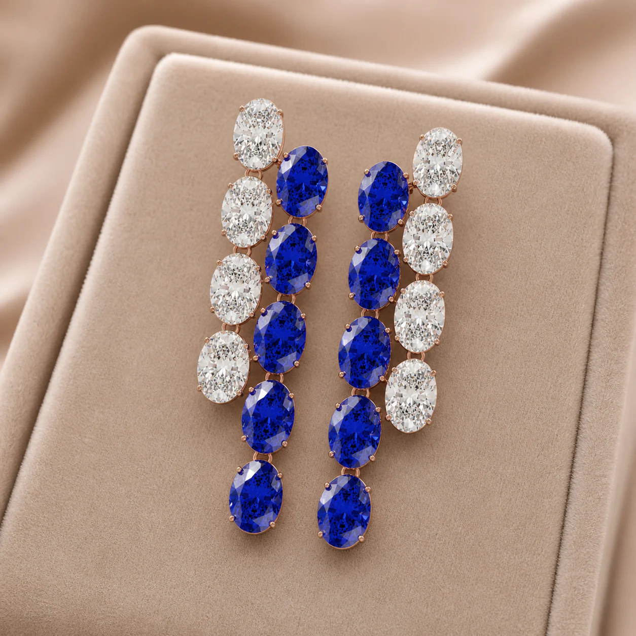Elongated earrings with deep blue stones and brilliant white accents